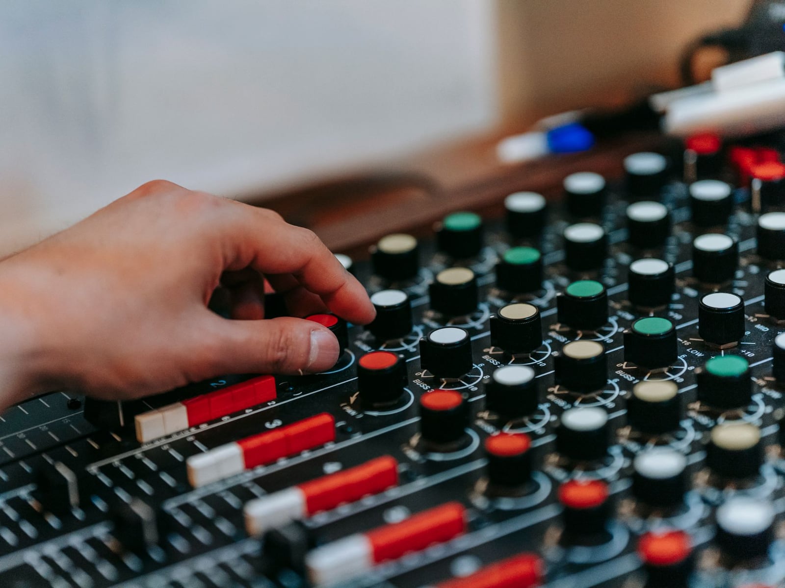 Professional analogue mastering equipment with VU meters in a treated studio environment.